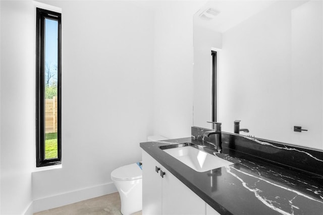 bathroom with vanity and toilet