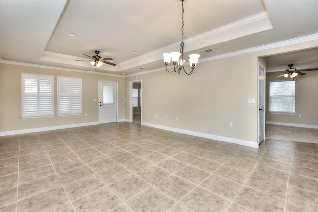 spare room featuring ornamental molding, ceiling fan with notable chandelier, light tile patterned flooring, and a tray ceiling