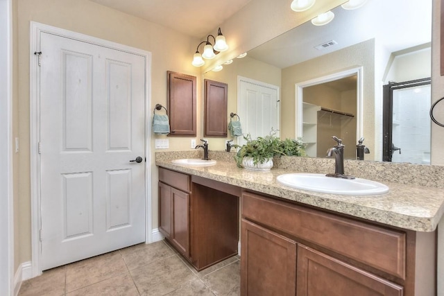 bathroom with tile patterned flooring and vanity