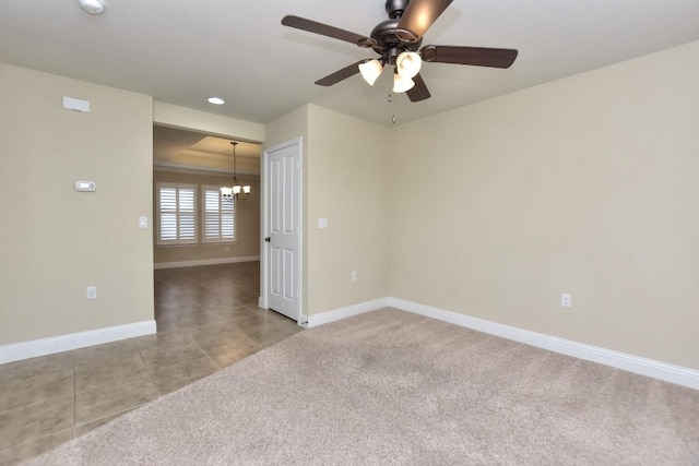 unfurnished room with light tile patterned floors and ceiling fan with notable chandelier