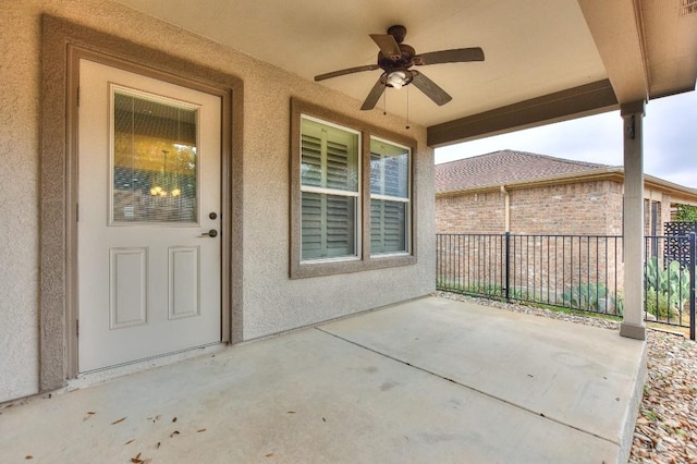 doorway to property with a patio and ceiling fan