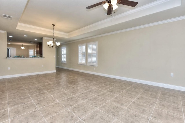 empty room with ornamental molding, a raised ceiling, and ceiling fan with notable chandelier