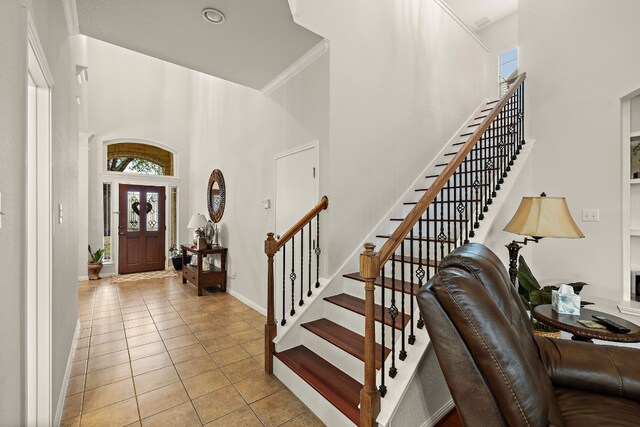 2621 Golden Gate Park, Austin, TX 78732 - entrance foyer featuring a high ceiling, crown molding, and light tile patterned floors