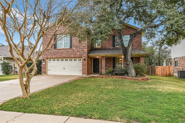 view of property with a garage, central AC, and a front yard