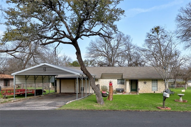 ranch-style house with a garage and a front yard