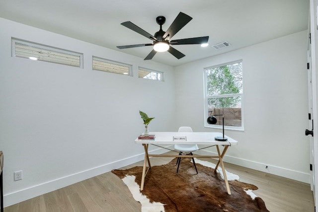 908 E 51st St, Austin, TX 78751 - home office featuring baseboards, light wood finished floors, and ceiling fan