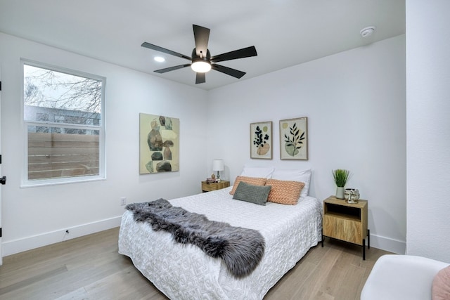 908 E 51st St, Austin, TX 78751 - bedroom with light wood-style flooring, baseboards, and a ceiling fan