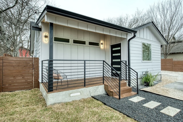 908 E 51st St, Austin, TX 78751 - view of exterior entry featuring board and batten siding