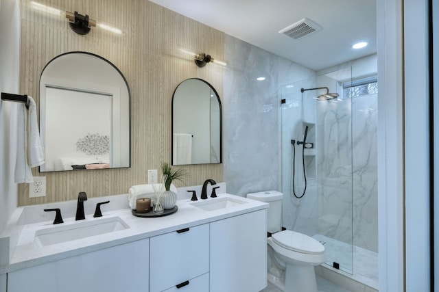 908 E 51st St, Austin, TX 78751 - bathroom with toilet, a marble finish shower, and double vanity