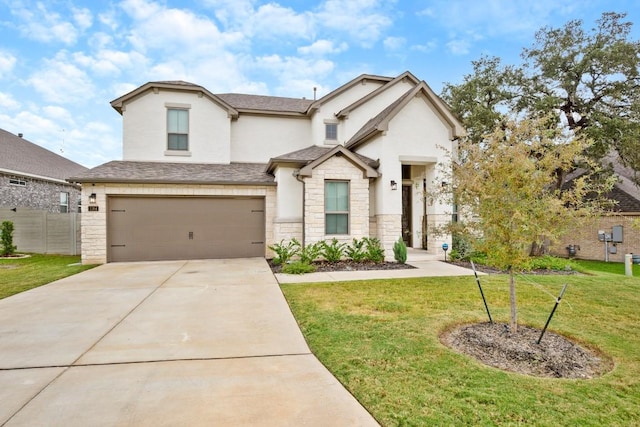 view of front facade featuring a garage and a front lawn