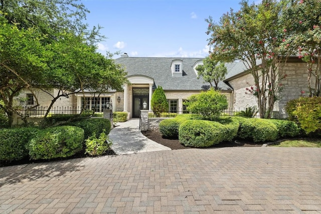 view of french country inspired facade