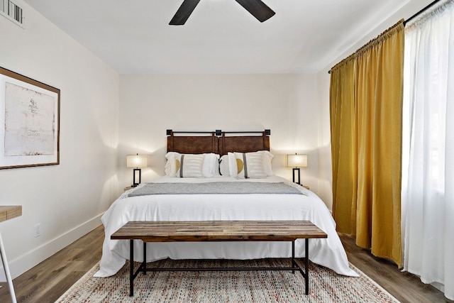 bedroom with wood-type flooring and ceiling fan