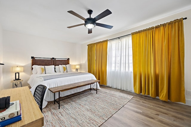 bedroom featuring wood-type flooring and ceiling fan