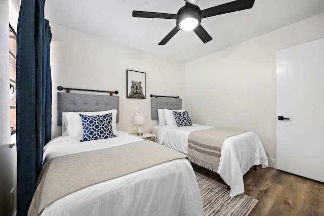 bedroom with wood-type flooring and ceiling fan