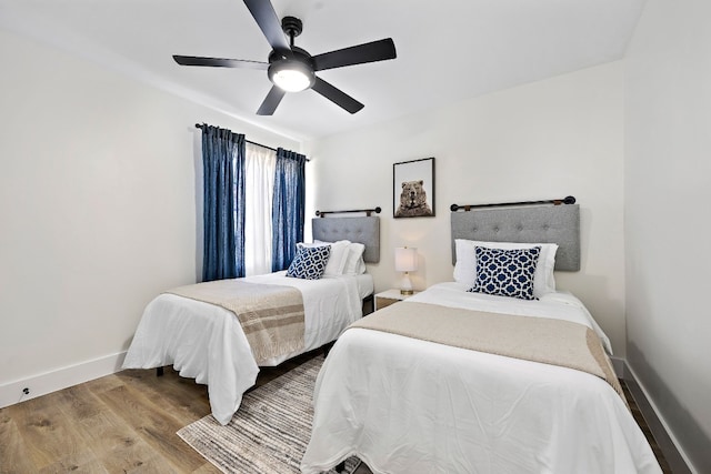 bedroom featuring hardwood / wood-style flooring and ceiling fan