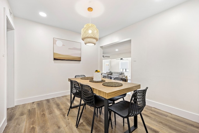 dining area featuring hardwood / wood-style flooring and ceiling fan