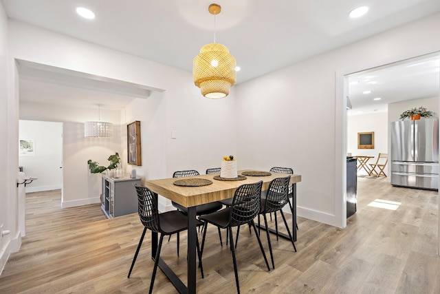 dining area with light wood-type flooring