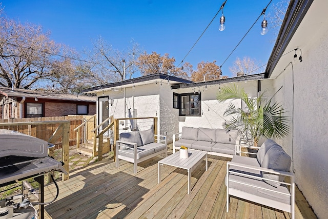 deck featuring area for grilling and an outdoor hangout area