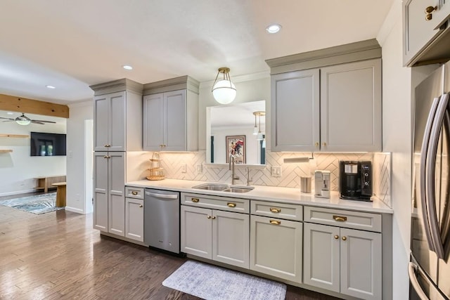 1713 Mariposa Dr, Austin, TX 78741 - kitchen with gray cabinets, stainless steel appliances, recessed lighting, tasteful backsplash, and light countertops