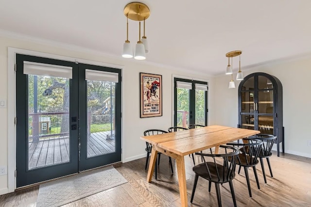 1713 Mariposa Dr, Austin, TX 78741 - dining space featuring french doors, healthy amount of natural light, and light wood-style floors