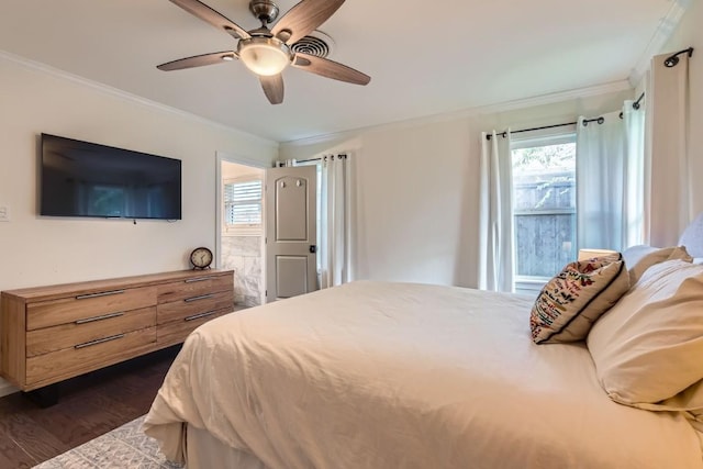1713 Mariposa Dr, Austin, TX 78741 - bedroom featuring ornamental molding, dark wood-style flooring, multiple windows, and a ceiling fan
