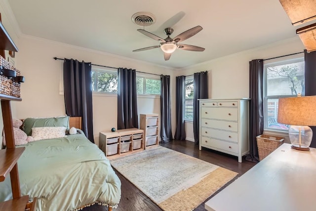 1713 Mariposa Dr, Austin, TX 78741 - bedroom featuring dark wood-type flooring, ornamental molding, and ceiling fan
