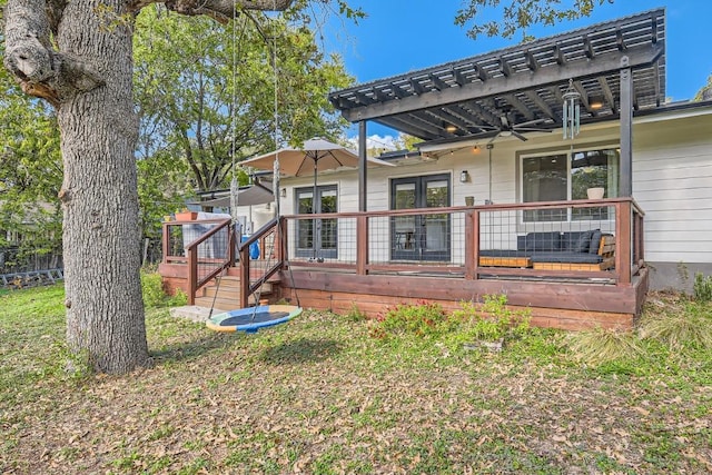 1713 Mariposa Dr, Austin, TX 78741 - back of property featuring french doors, a deck, a pergola, a ceiling fan, and a yard