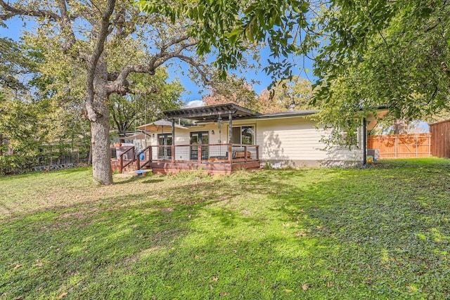 1713 Mariposa Dr, Austin, TX 78741 - rear view of property with a deck, ceiling fan, and french doors