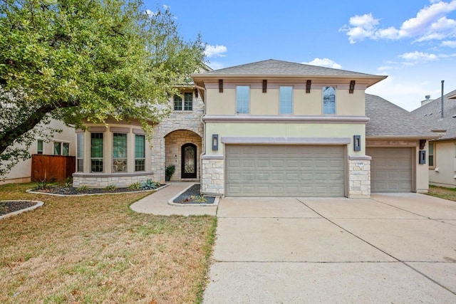 view of front facade featuring a garage and a front yard