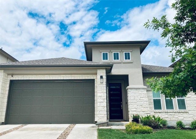 prairie-style home featuring a garage