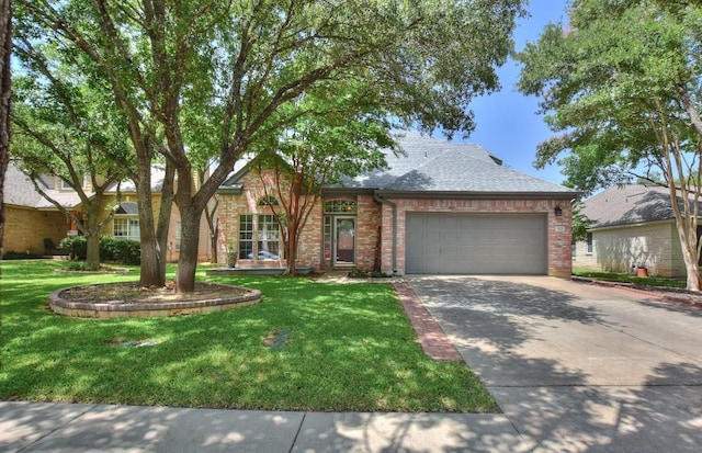 123 Parque Vista Dr, Georgetown, TX 78626 - view of front facade featuring a garage, driveway, brick siding, a front yard, and a shingled roof