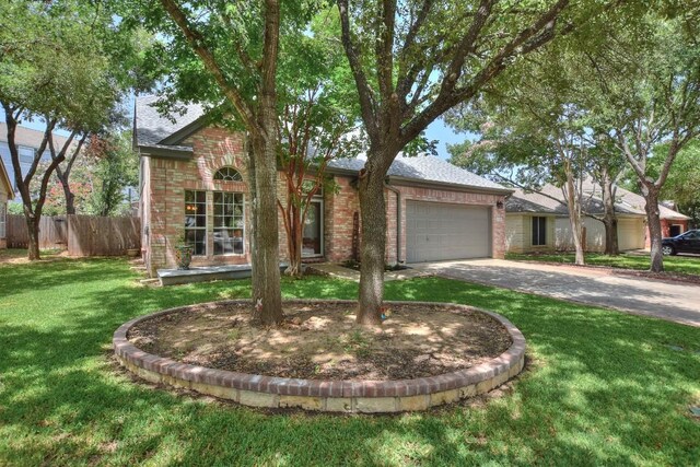 ranch-style home with a garage and a front lawn