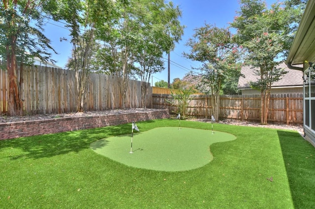 123 Parque Vista Dr, Georgetown, TX 78626 - fenced backyard featuring a putting area
