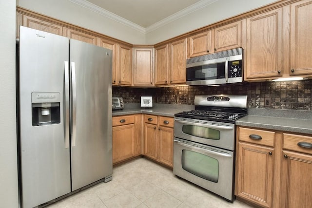 123 Parque Vista Dr, Georgetown, TX 78626 - kitchen with appliances with stainless steel finishes, dark countertops, ornamental molding, light tile patterned floors, and backsplash