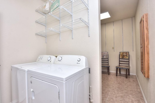 123 Parque Vista Dr, Georgetown, TX 78626 - washroom featuring washing machine and dryer, baseboards, and light tile patterned floors