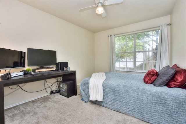 bedroom with ceiling fan and light colored carpet