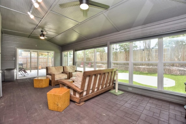 sunroom / solarium with ceiling fan and lofted ceiling