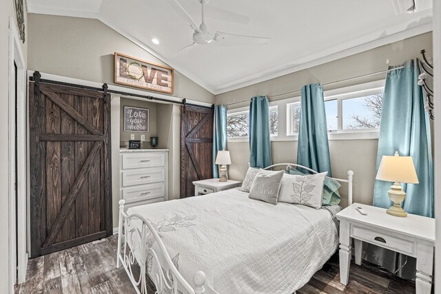 13006 Ranch Rd Unit 2341, Burnet, TX 78611 - bedroom featuring a barn door, wood finished floors, lofted ceiling, ceiling fan, and recessed lighting