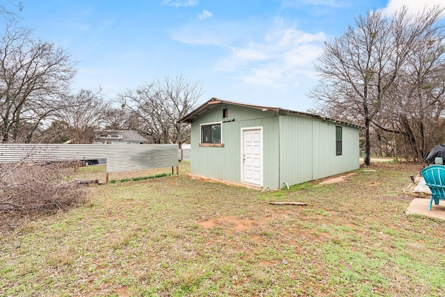 view of outbuilding with a lawn