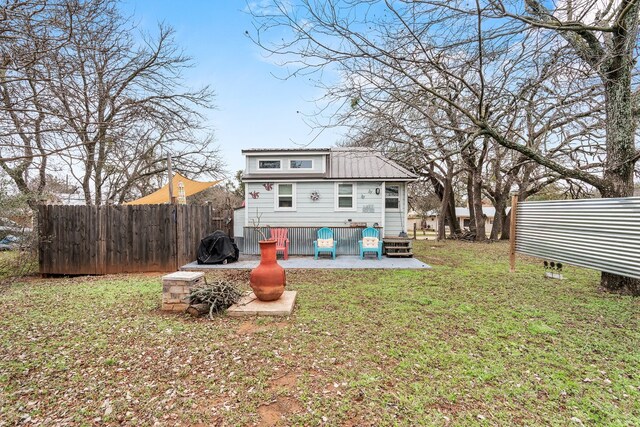13006 Ranch Rd Unit 2341, Burnet, TX 78611 - back of property featuring a patio area and a metal roof