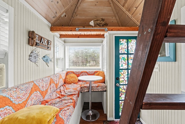 living room featuring radiator, hardwood / wood-style floors, beamed ceiling, breakfast area, and wooden ceiling