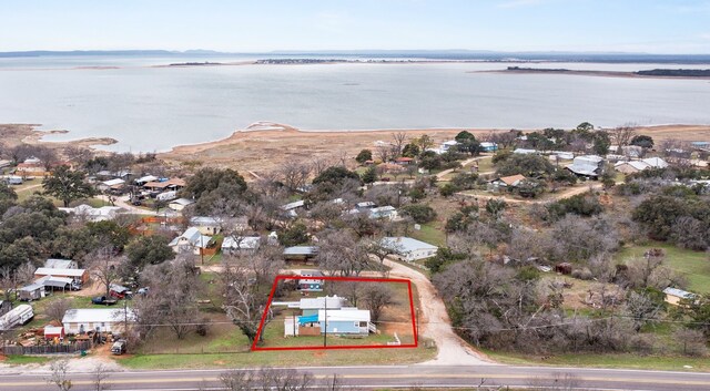 13006 Ranch Rd Unit 2341, Burnet, TX 78611 - aerial perspective of suburban area featuring a nearby body of water and property parcel outlined
