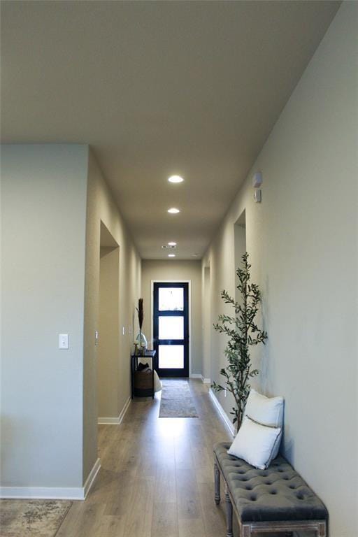 corridor featuring light hardwood / wood-style floors