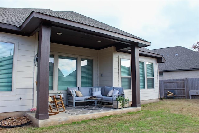 back of house with an outdoor living space, a yard, and a patio area