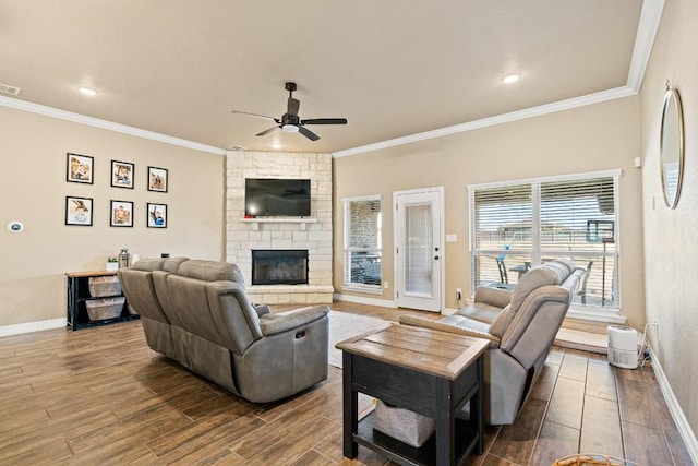 living room featuring crown molding, a stone fireplace, ceiling fan, and hardwood / wood-style flooring