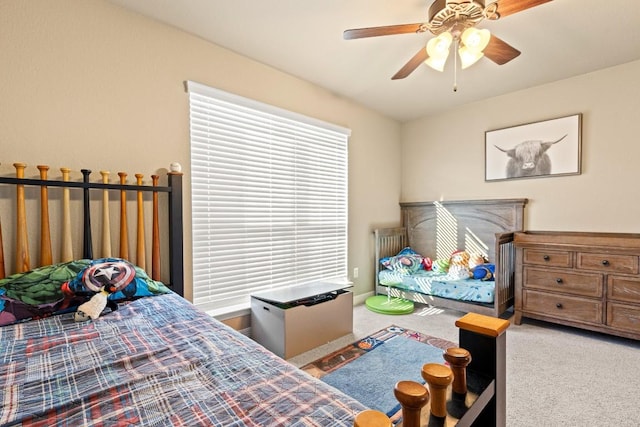 carpeted bedroom with ceiling fan