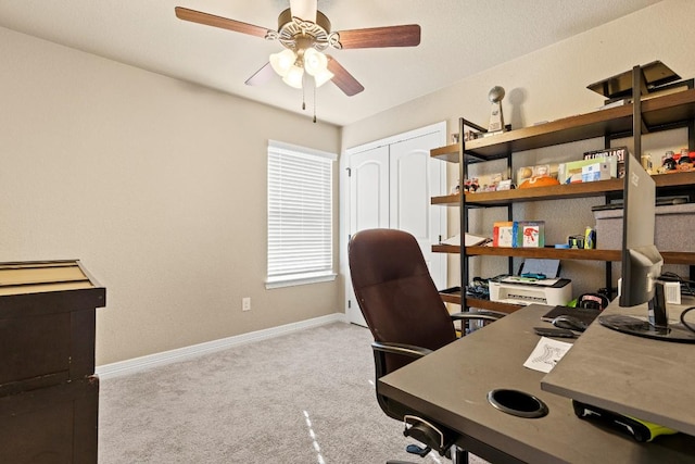 office area with light colored carpet and ceiling fan