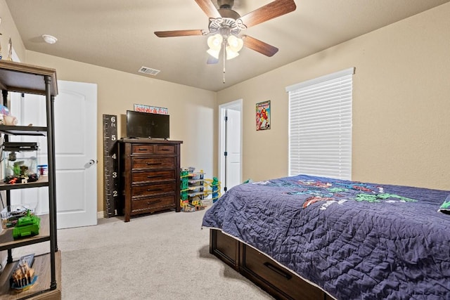 carpeted bedroom with ceiling fan