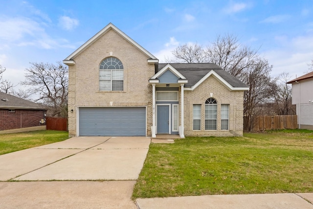 view of front of home with a garage and a front yard