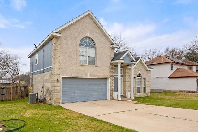 front of property featuring a garage, a front yard, and cooling unit